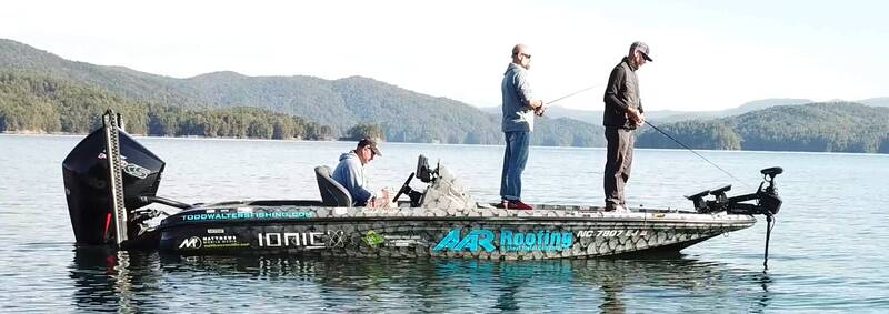Three men fishing on an Ionic branded bass boat.