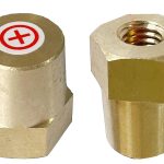 Two terminal adapters, the positive terminal adaptor upright, and the negative terminal adaptor upside down.