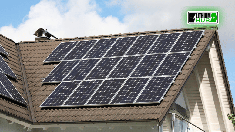 Solar panels installed on the roof of a house, showcasing renewable energy technology in a residential setting.