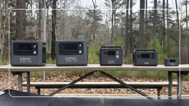 Full Ionic GenBox portable power station lineup arranged by size on an outdoor picnic table
