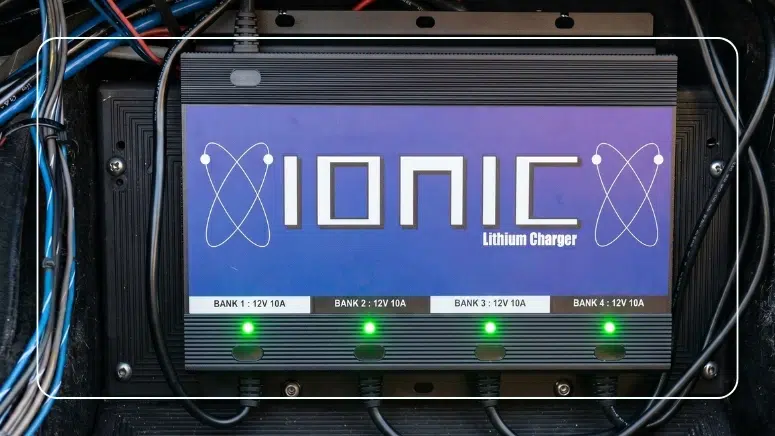 Ionic 4-bank lithium charger with all four 12V 10A banks active and green status lights on