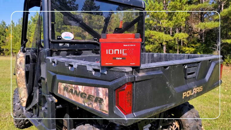 Ionic lithium battery mounted in the cargo bed of a Polaris Ranger UTV