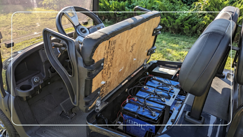 Ionic lithium deep cycle batteries installed under a golf cart seat