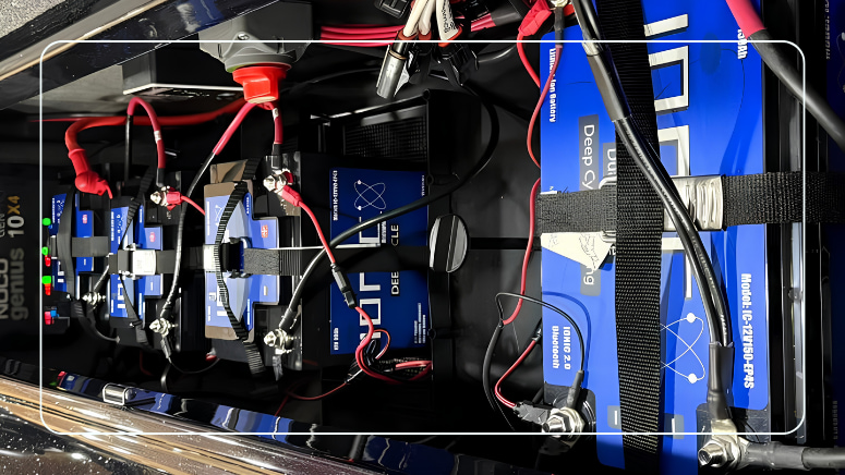 Clean Ionic LiFePO4 deep cycle battery bank with Bluetooth monitoring and a multi-bank charger in a boat