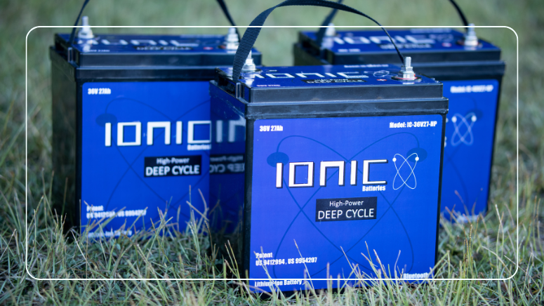 Three Ionic lithium deep cycle batteries lined up outdoors for a solar battery bank
