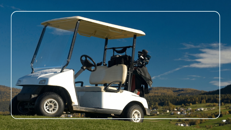 White golf cart parked on a golf course fairway before a golf cart battery test