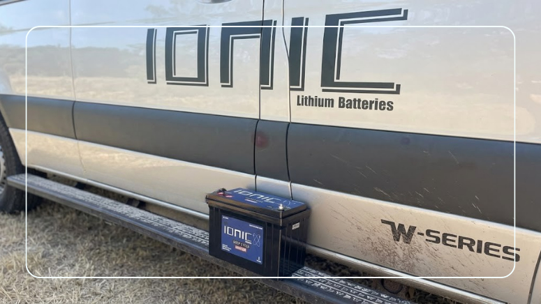 Ionic lithium deep cycle battery on the running board of a camper van, ready to replace an aging RV battery bank
