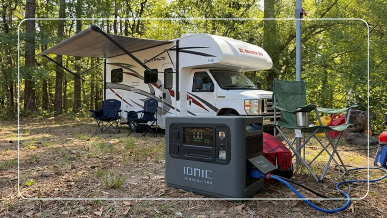 Ionic GenBox 1200 portable power station at a wooded campsite in front of a Class C motorhome