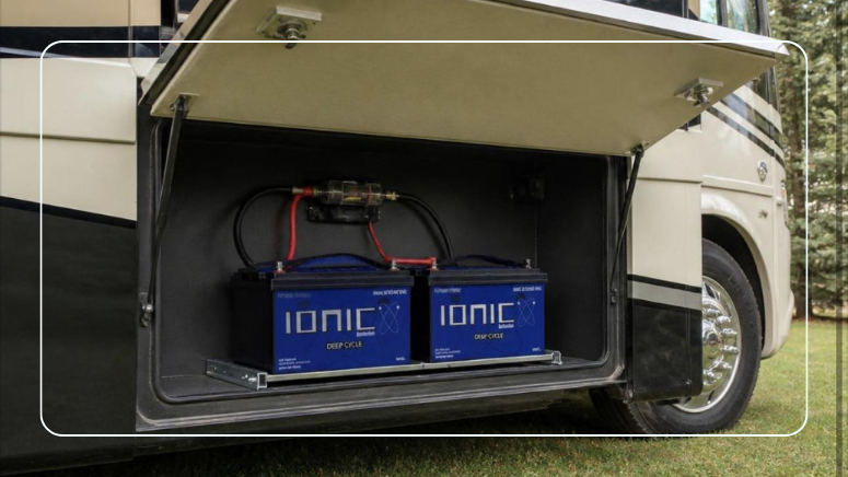 Two Ionic lithium deep cycle batteries installed in an RV motorhome battery compartment