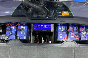 Ionic lithium deep cycle batteries wired in series in a boat battery compartment with an onboard lithium battery charger