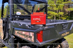 Ionic lithium battery mounted in the cargo bed of a Polaris Ranger UTV