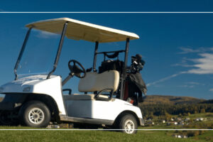White golf cart parked on a golf course fairway before a golf cart battery test