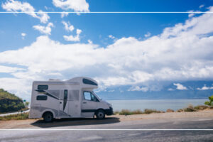 Motorhome parked at a scenic overlook, powered by RV lithium house batteries for off-grid camping